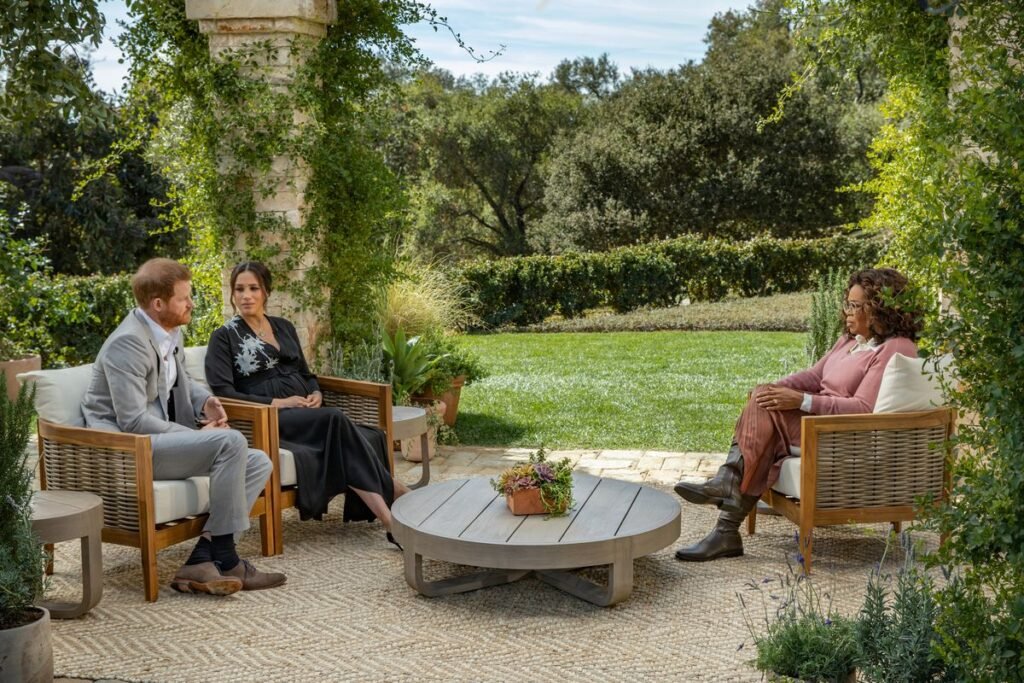 Oprah Winfrey conducting interview with Prince Harry of England and his wife Meghan Markle